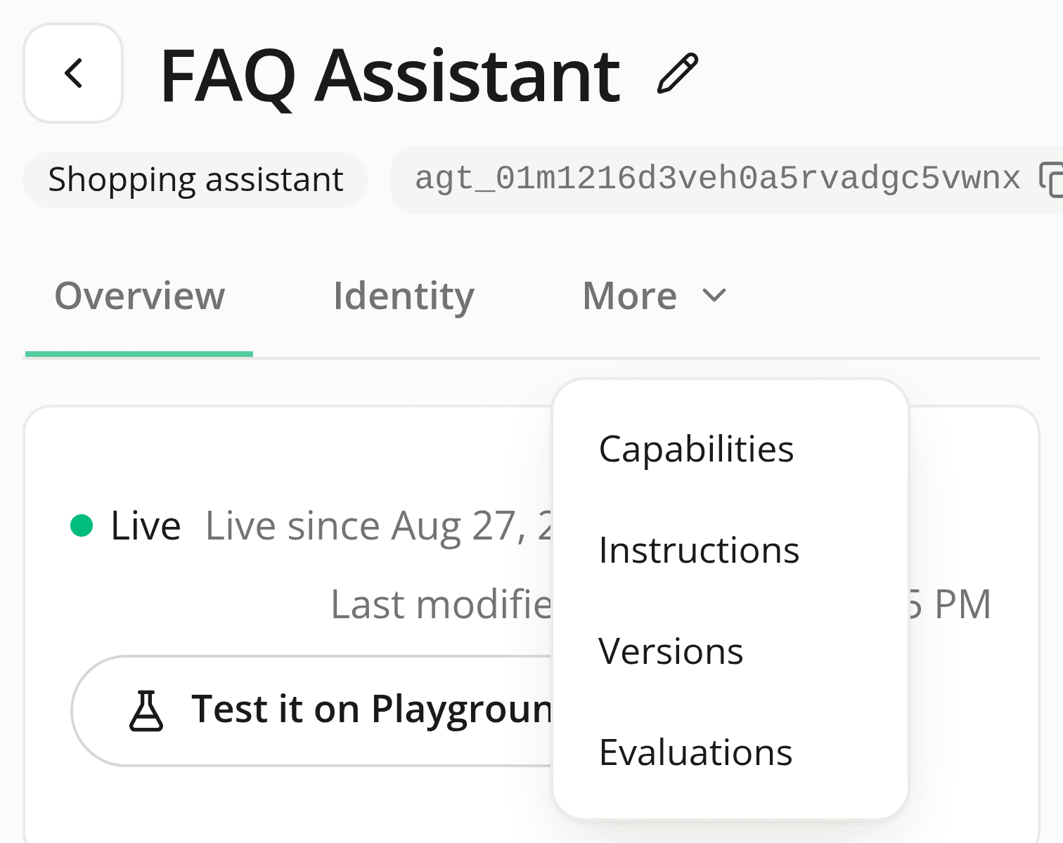 An agent's detail page on a phone, showing Overview and Identity tabs plus a More trigger, open to reveal Capabilities, Instructions, Versions, and Evaluations.